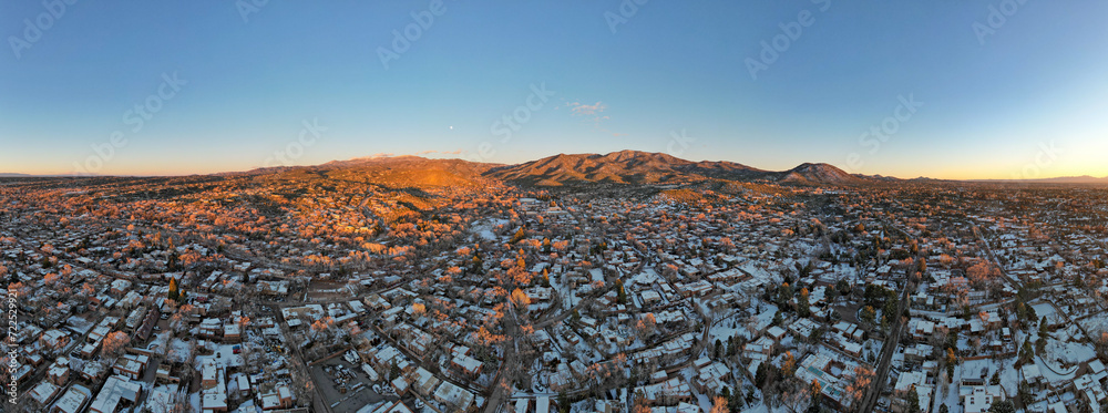 Fototapeta premium Sunset drone photograph above Santa Fe, New Mexico in winter.