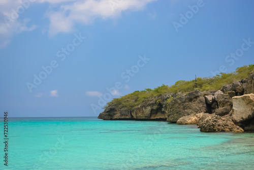Little Knip beach - paradise white sand beach with blue sky and clear azure water in Curacao  Netherlands Antilles  a Caribbean tropical Island.