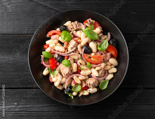 White bean tuna salad with olive, red onion, tomatoes. Healthy food