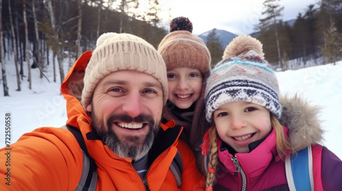 Man is capturing moment with two children in snow. This image can be used to depict fun winter activity and family bonding