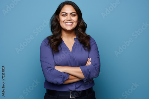 Woman wearing blue shirt and black pants. Suitable for fashion and casual wear advertisements
