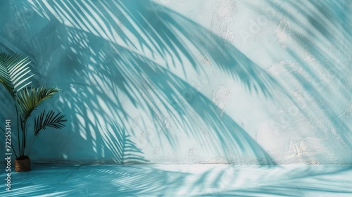 Minimal product placement background with palm shadow on blue plaster wall. Luxury summer architecture interior aesthetic