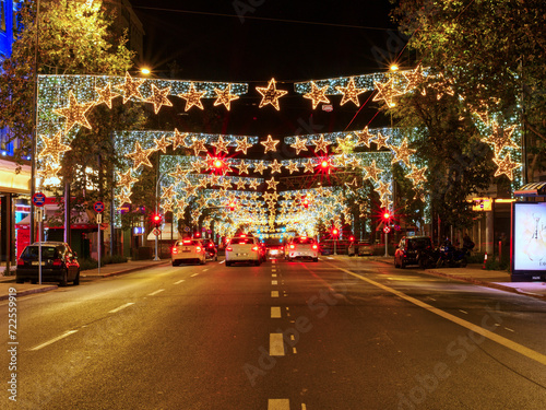 Athens, Greece - December 25, 2023: City traffic avenue with Christmas decorations