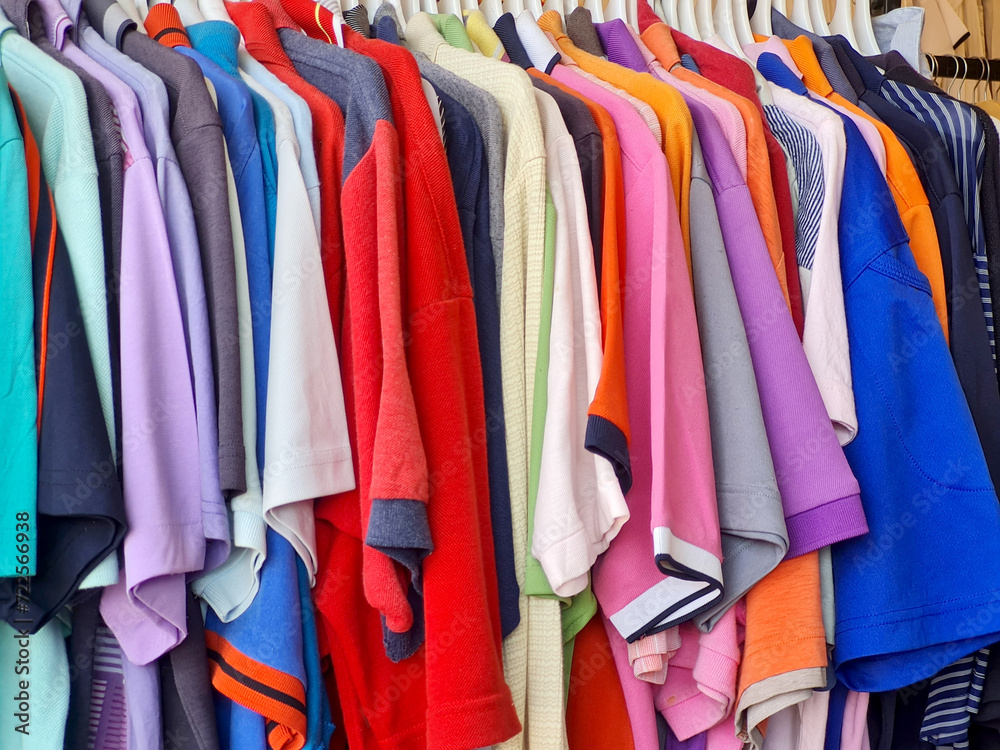 colorful used clothes in thrift stores, used clothing business to reduce clothing waste and reuse existing items. non-disposable concept.