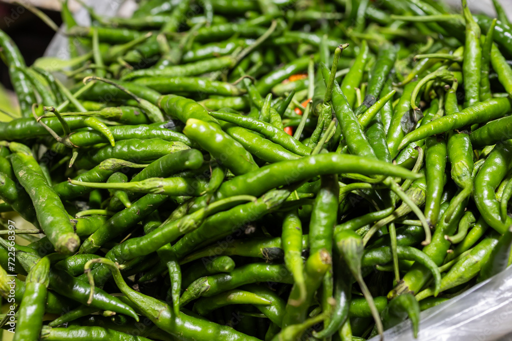 Green small hot chilli at vegetable store for sale at evening Green small hot chilli at vegetable store for sale at evening