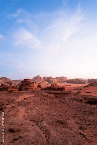 Portrait - Wadi Rum, Jordan. A beautiful vibrant sunset, Arabian desert, a dystopian martian landscape with unique rock formations and dunes. Backdrop for graphic resource or copy space
