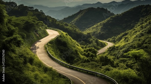 A winding road winding gracefully through lush green hills.