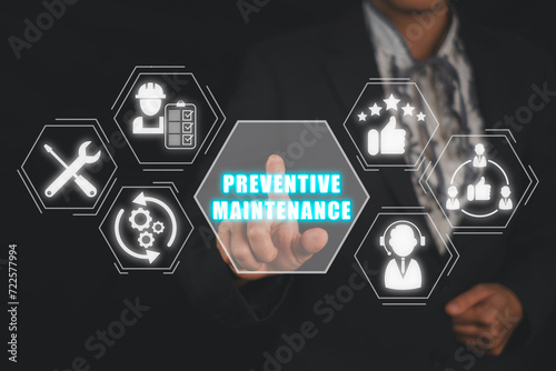 Preventive Maintenance concept, Business people hand touching preventive maintenance icon on virtual screen. Malfunction, Inspection, Conditions, Customer Service, Repair, Certification, Replacement. photo