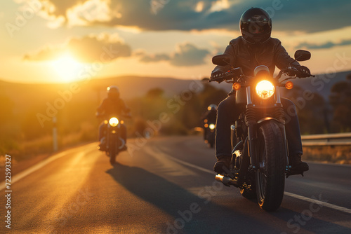 Two People Riding Motorcycles on a Road at Sunset © Ilugram