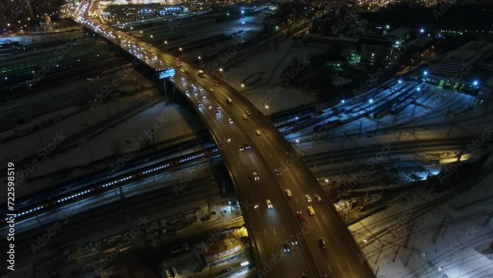 Road traffic on Rizhskaya flyover above railway at winter evening. Road traffic on Rizhskaya flyover above railway at winter evening.