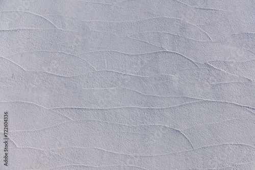厚手の塗料を鏝で塗り伸ばした波の模様、背景素材