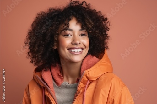 Beautiful african american woman in winter jacket smiling at camera