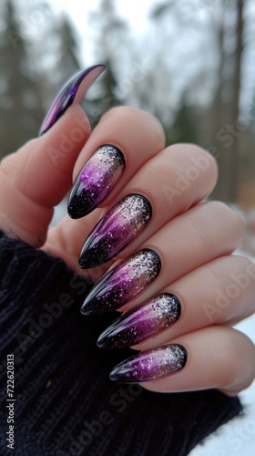 A shimmering purple hand adorned with glossy nails, a fashion statement that glitters under the outdoor light