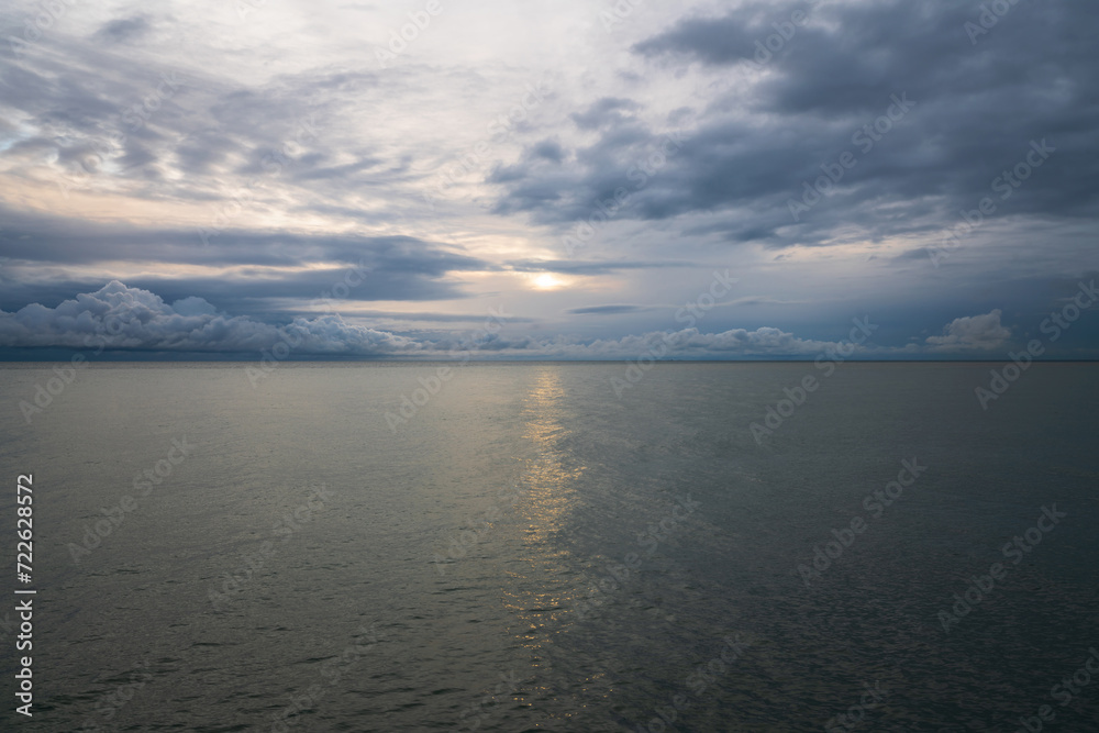 View of the Black Sea on the coast of Sochi against the sunset sky, Sochi, Krasnodar Krai, Russia