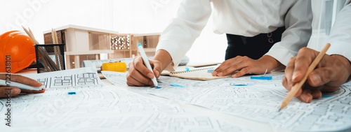Worker, architect and engineer work on real estate construction project oratory planning with cartography and cadastral map of urban town area to guide to construction developer business plan of city photo