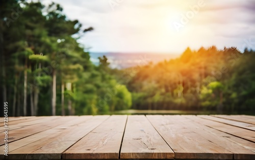 Empty wooden table with a blurred landscape in the background.