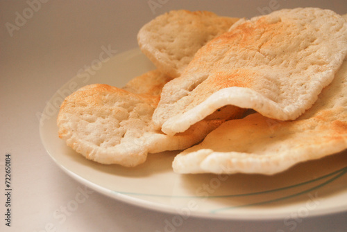 Close up photo of grilled kemplang crackers which is a typical food from Sumatra made from fish-based ingredients photo