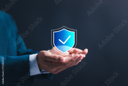Insurance and assurance concept, Businessman holding virtual insurance icons for medical, life, car, home, travel insurance. photo