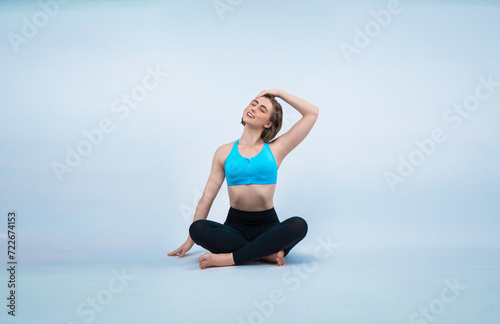 Full body length gaiety shot athletic and sporty woman doing healthy and meditative yoga exercise workout posture on isolated background. Healthy active and body care lifestyle