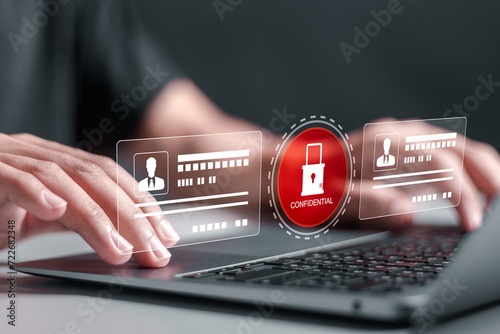 Employee confidentiality concept. Person use laptop with virtual padlock icon with confidential word to access documents data and cyber security for managing corporate files and employee information. photo