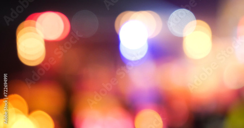 Vibrant Bokeh abstract blurred background music festival stage show performance party. Colorful bokeh background spark animate motion. Backdrop display with twinkling night life shape blinking light