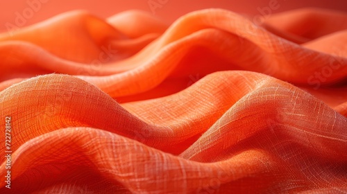  a close up of an orange cloth with a blurry image of the fabric on the bottom of the image.