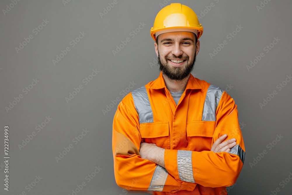 Confident male engineer worker happy smile on gray background - obrazy, fototapety, plakaty 