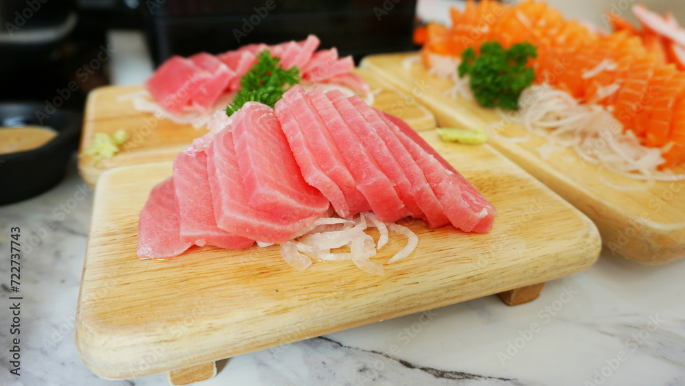 Tuna sashimi with wasabi serve on wooden dish. Japanese food Tuna sashimi and wasabi prepared for eating on table, traditional Japanese food. raw tuna Tuna sashimi with wasabi serve on wooden dish. Japanese food Tuna sashimi and wasabi prepared for eating on table, traditional Japanese food. raw tuna