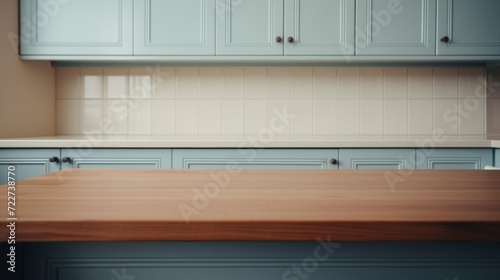 Empty wooden countertop with a clean, minimalist design in a modern light blue kitchen interior.