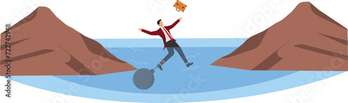 Businessman being trapped with ball and chain at the cliff