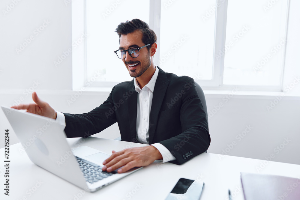 Man in office businessman sitting at desk and working in laptop, finance and startup concept, working lifestyle in bright office. Man in office businessman sitting at desk and working in laptop, finance and startup concept, working lifestyle in bright office.