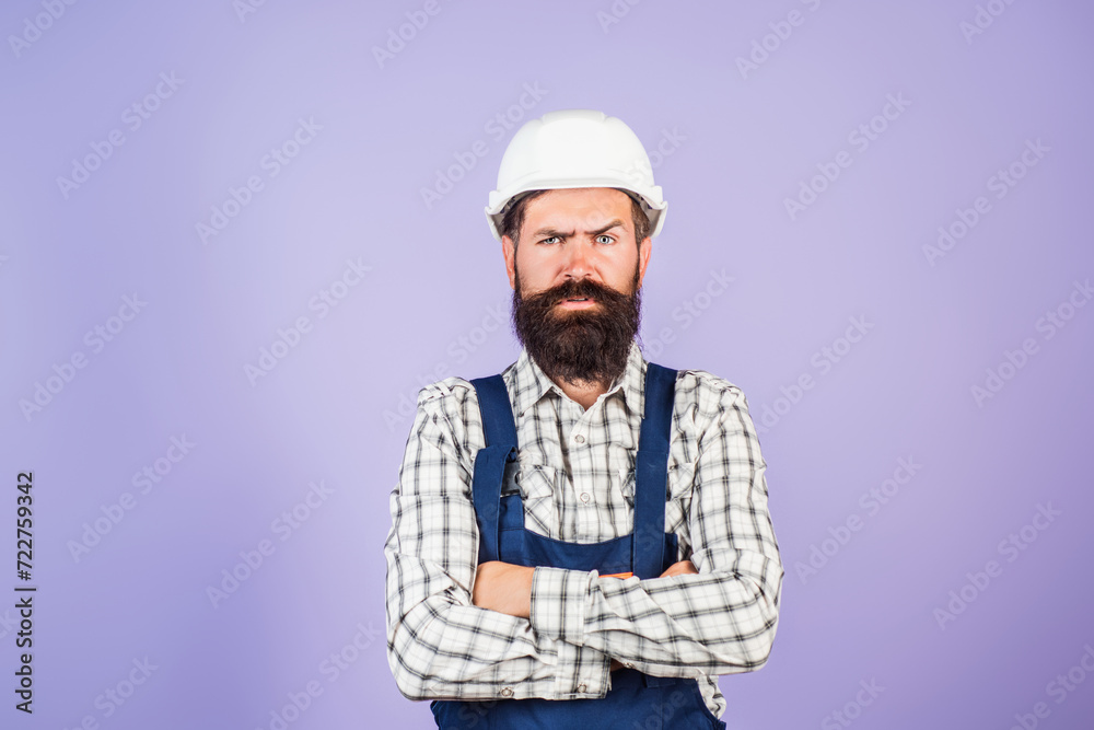 Funny bearded builder worker. Handyman builder in hardhat. Building concept. Builder foreman. Man in helmet studio portrait. Engineer worker in hardhat. Construction site manager.