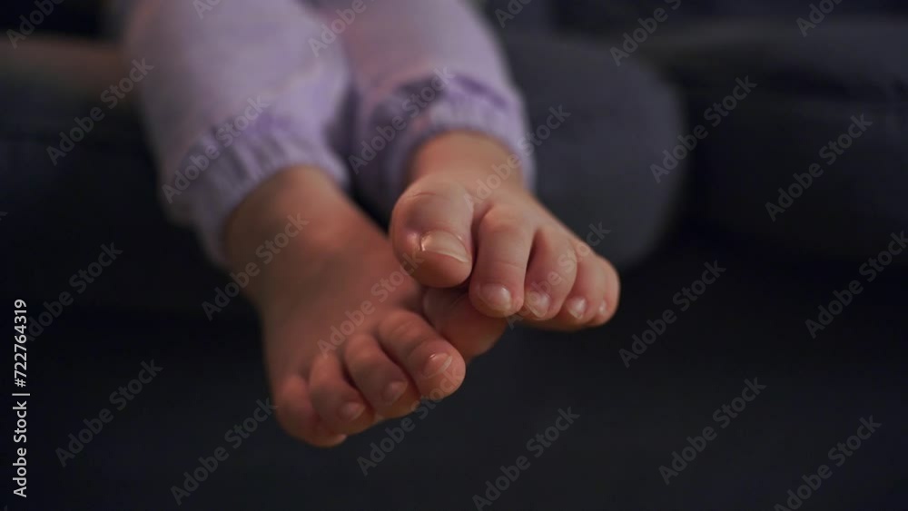 Barefoot Child Relaxing on Couch Barefoot Child Relaxing on Couch