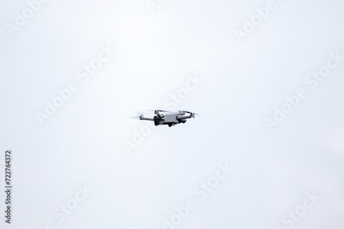 Fototapeta Naklejka Na Ścianę i Meble -  drone is flaying against isolated blue sky