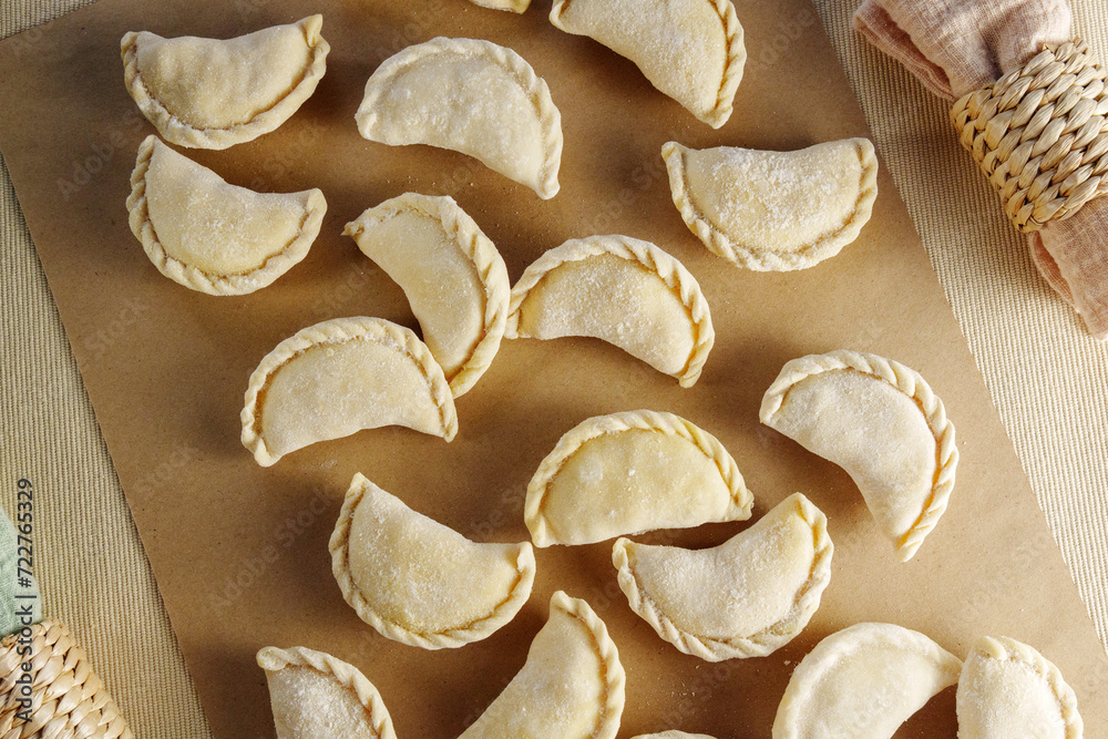 Delicate Dumpling Medley on a Vibrant Wooden Palette Delicate Dumpling Medley on a Vibrant Wooden Palette