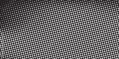 Halftone dotted background. Black dots in modern style on a white background. Vintage illustration for design concept.