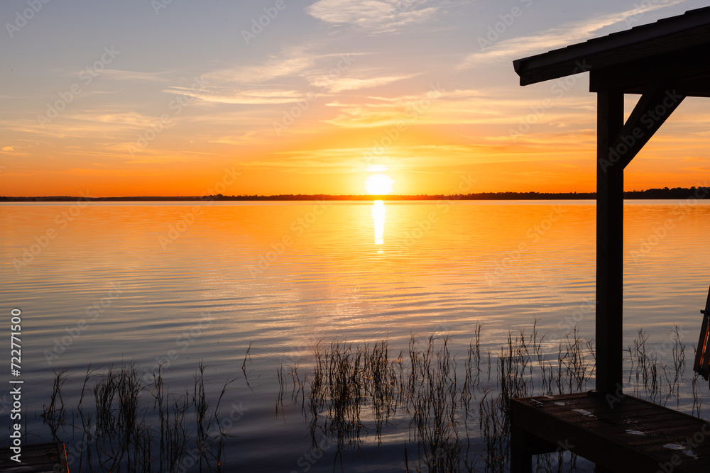 Golden hour horizon overlooking lake with beautiful sky