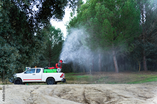 vehicle spraying against the caterpillar pine processionary photo