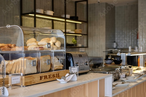 Assortment of sliced bread, rolls, croissants and pastries at the breakfast counter of the Plaza Premium priority pass lounge at Sydney Kingsford Smith Airport