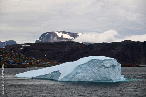 Coastal view with iceberg of Upernavik village a Greenlandic town in Upernavik District, Avannaata Communia photo