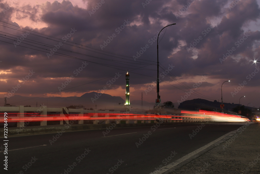 View of a minaret and bridge on a evening with Light trace  in South Indian City  