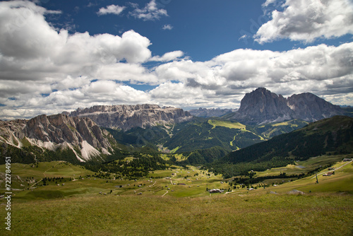 Mountain huts with the beautiful mountainous landscape of Val Gardena in Dolomites.