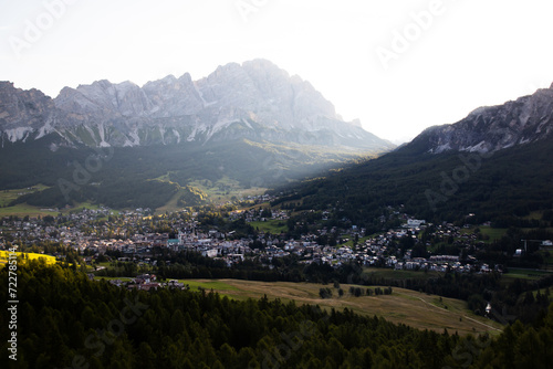 Cortina d Ampezzo town panoramic view with alpine green landscape and massive Dolomites Alps