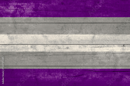 Grey asexuality flag on wooden surface. Grey asexuality flag is one of the sexual minority of LGBT community photo