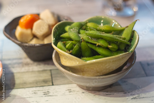 Close up of a bowl of Edamame or green soybean.