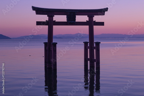 Beautiful dusk of a grand torii gate at Lake Biwa  Biwako   Takashima  Shiga  Japan. Silhouette. Copy space