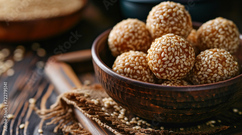 Golden sesame balls, crunchy exterior, glistening with sesame seeds, revealing soft, chewy centers, tempting with their aromatic sweetness.