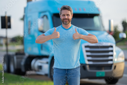 Men driver near lorry truck. Man owner truck driver. Millennial trucker. Trucking owner. Transportation industry vehicles. Handsome man posing in front of truck.