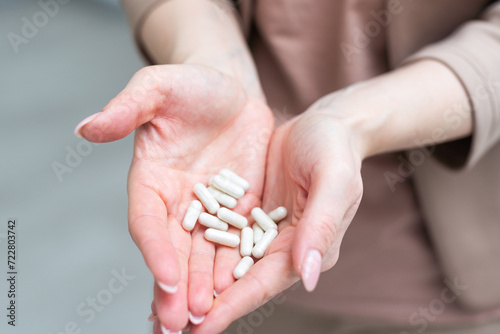 Medicine in hand on a white background