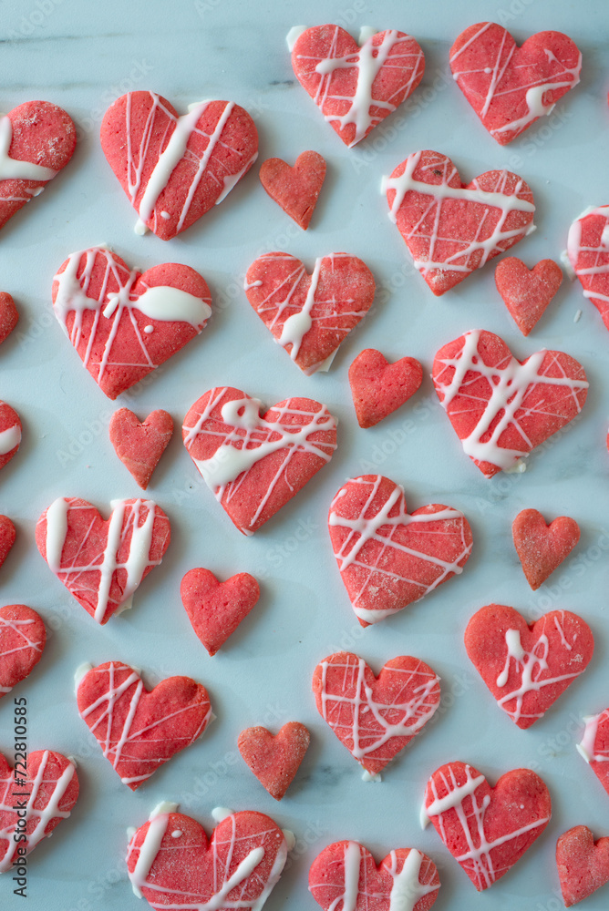 Heart shaped cookies with pink and white icing Heart shaped cookies with pink and white icing